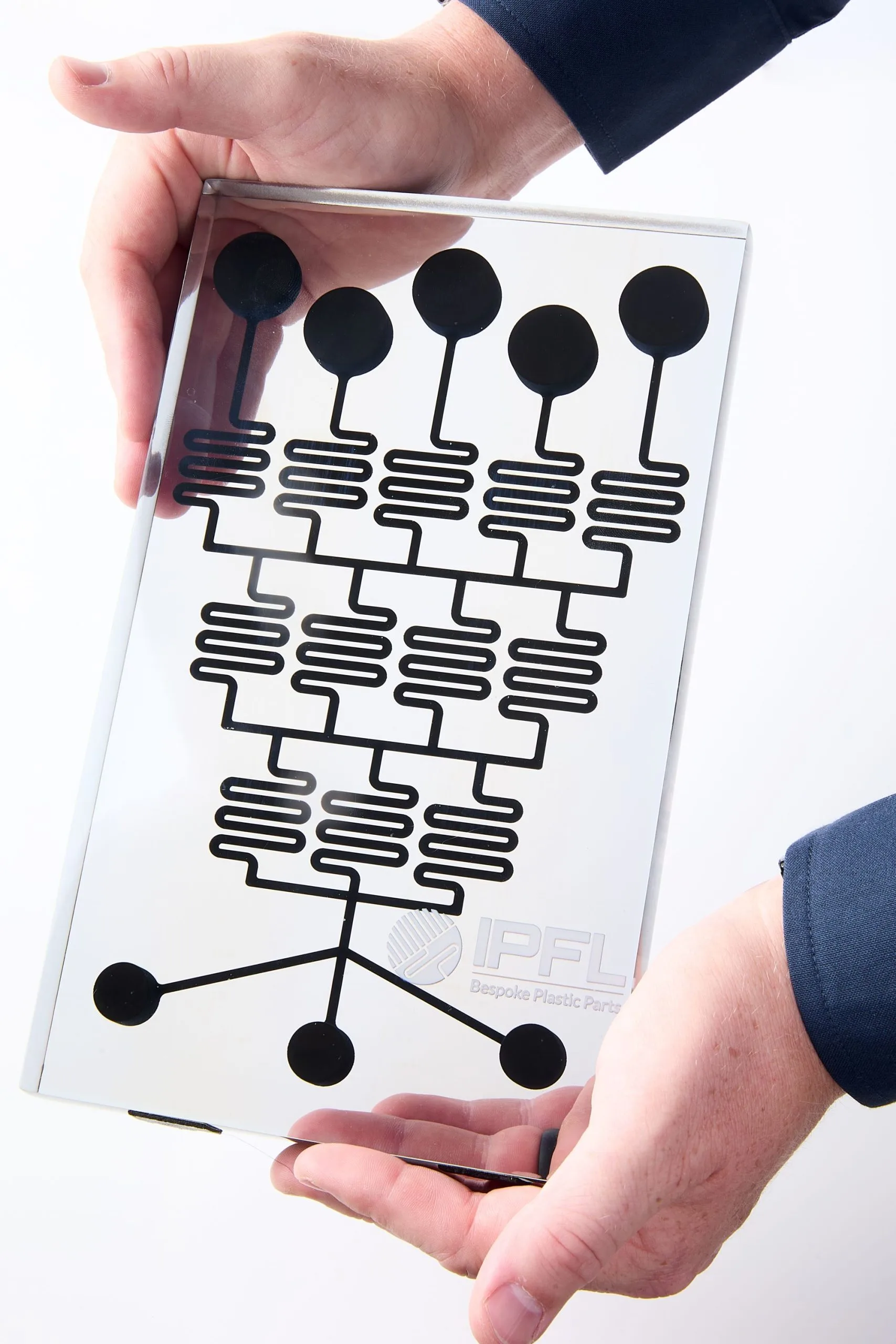 Microfluidic component produced using high-resolution PolyJet 3D printing, manufactured in-house as a bespoke plastic part by a leading plastic fabrication company in the UK.