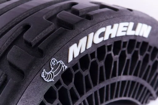 Multi-material PolyJet flexible tyre with Michelin Man detailing, produced in-house by IPFL as a bespoke plastic part through our plastic fabrication services.